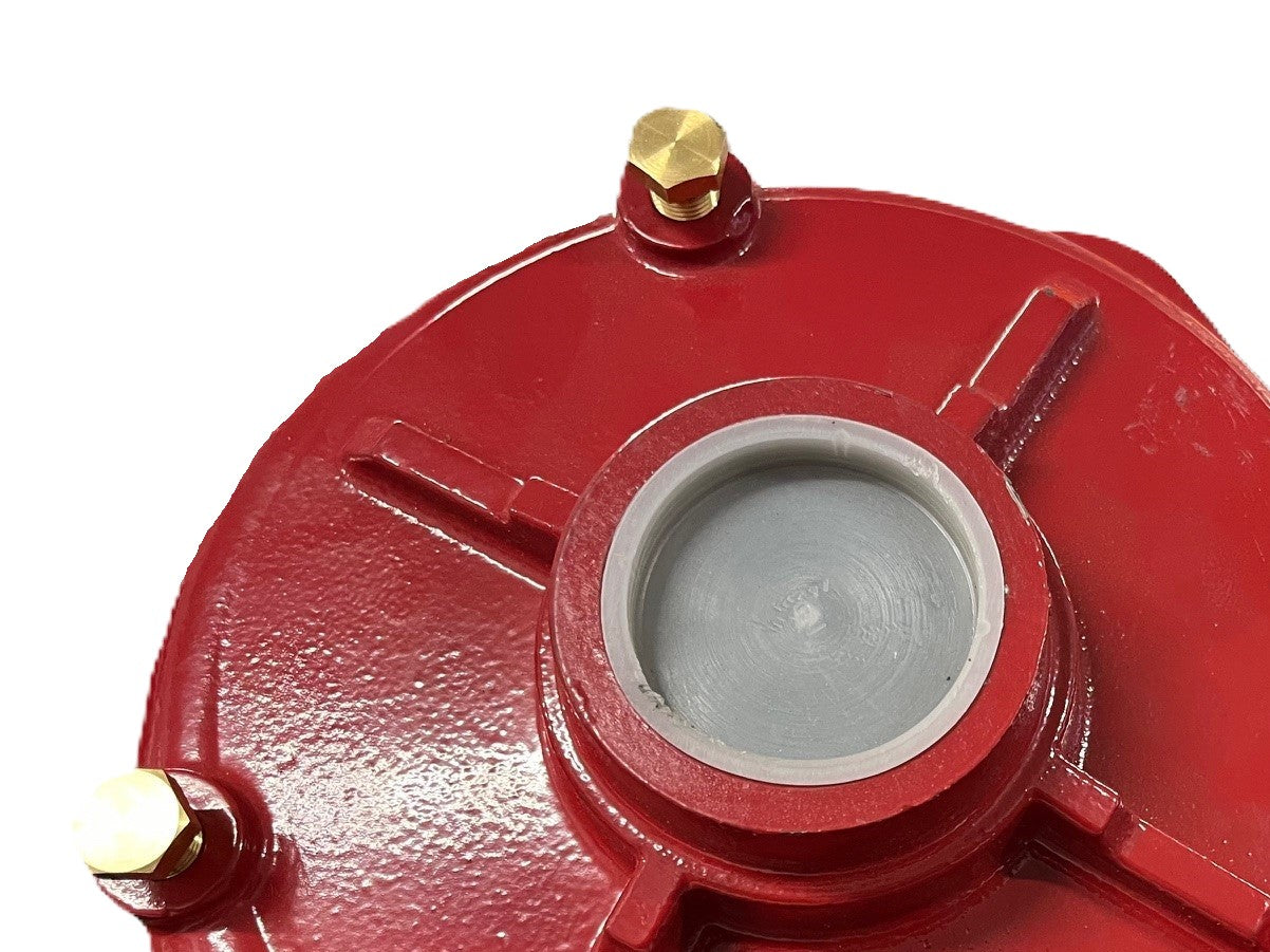 Close-up of a Scintex Pump Wet End, showcasing its red structure with a central circular opening and three protruding sections. The glossy surface highlights three visible brass bolts.